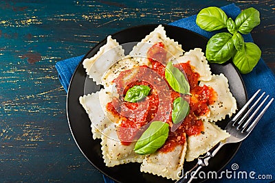 Ravioli with tomato sauce and basil Stock Photo