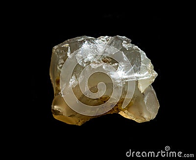 Raw agate quartz minerals nugget from Novy Urengoy, Russia. A backlight photo of stone isolated on black. Geology Editorial Stock Photo