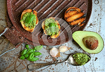 Raw ,alkaline food with avocado and basil pesto with garlic Stock Photo