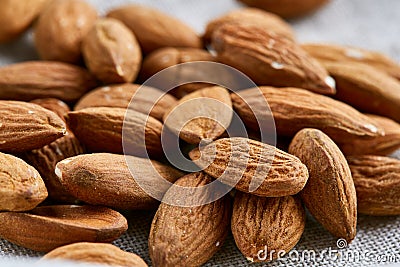 Raw almond food background, close-up, shallow depth of field, macro. Stock Photo