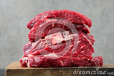 Raw beef on a butcher`s board Stock Photo