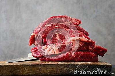 Raw beef on a butcher`s board Stock Photo