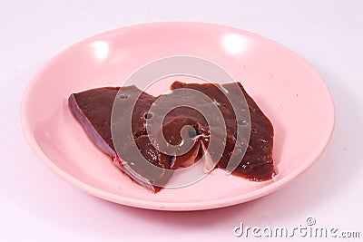 Raw beef liver on pink dish Stock Photo