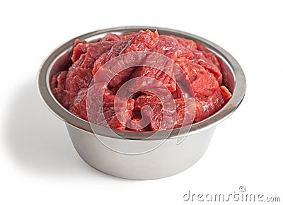 Raw beef meal in bowl, fresh, natural food for dog or cat Stock Photo