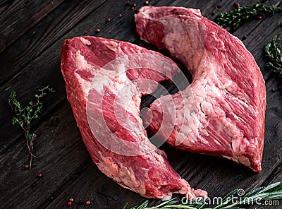 Raw beef tri-tip steak for BBQ on wooden Stock Photo