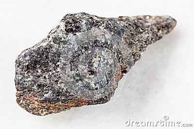 raw biotite nepheline syenite stone on white Stock Photo