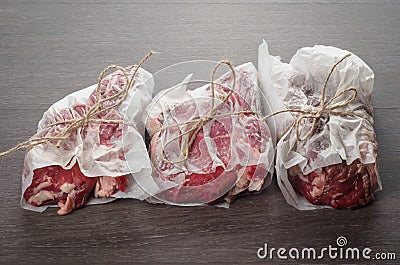 Raw Bone-in Rib eye Steak on wooden background Stock Photo