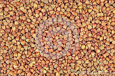 Raw buckwheat groats background, dry cereal seeds, large horizontal detailed textured macro closeup abstract grain texture pattern Stock Photo