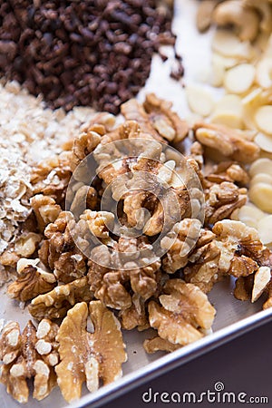 Raw cacao, sliced almonds, walnut, cashew Stock Photo