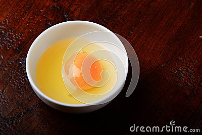 Raw chicken egg in the bowl Stock Photo
