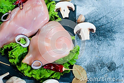 Raw chicken fillet on cutting board with spices and herbs. Stock Photo