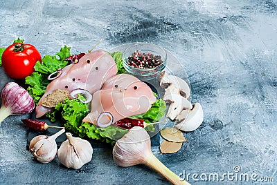 Raw chicken fillet on cutting board with spices and herbs. Stock Photo