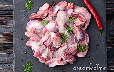 Raw chicken giblets gizzard ( stomach ) , meat background Stock Photo