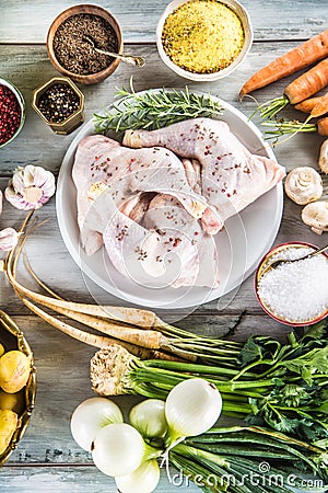 Raw chicken legs with assortment spices and vegetables Stock Photo