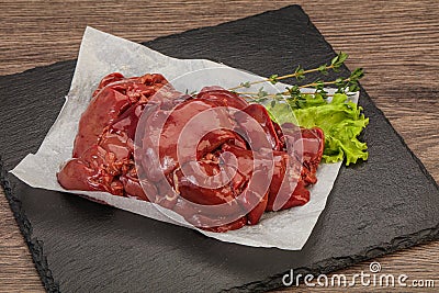 Raw chicken liver over board Stock Photo