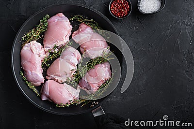 Raw chicken meat on pan on black backgroundtop viewwith space for text Stock Photo