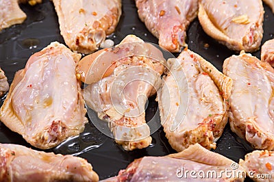 Raw chicken wings with spices ready for cooking Stock Photo