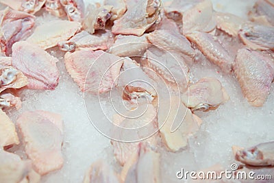 Raw chicken wings on top of ice on sale Stock Photo