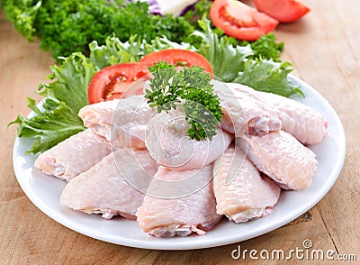 Raw chicken wings with vegetables Stock Photo