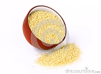 Raw couscous in bowl isolated Stock Photo