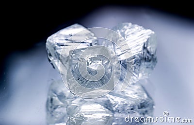 Raw diamonds isolated on black background. Stock Photo