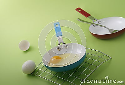 Raw egg on a frying pan Stock Photo