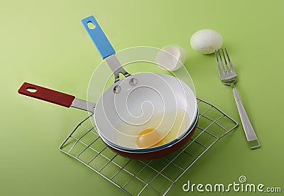 Raw egg on a frying pan Stock Photo