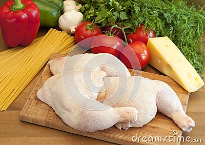 Raw fresh chicken legs on a cutting board Stock Photo