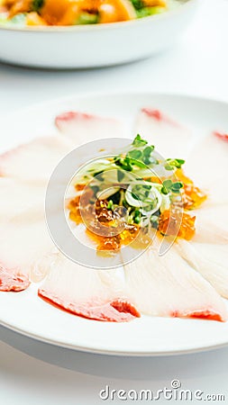 Raw fresh Hamaji fish meat sashimi in white plate Stock Photo