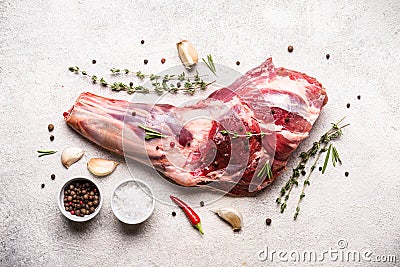 Raw fresh Lamb Meat shank and seasonings on gray concrete background Stock Photo