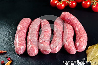 Raw and fresh meat. Fresh sausages and chicken meat ready to cook. Stock Photo