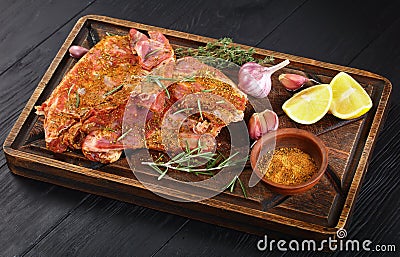 Raw fresh spare lamb ribs on board Stock Photo