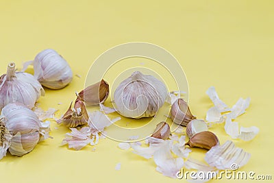 Garlic on yellow background, alternative medicine virus protection concept Stock Photo
