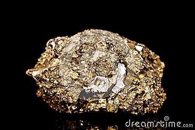 Raw golden iron pyrite mineral stone in front of black background Stock Photo