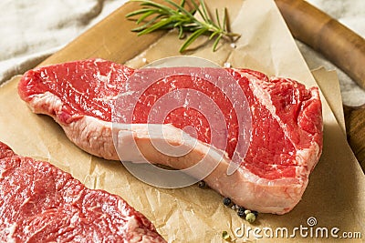 Raw Grass Fed NY Strip Steaks Stock Photo