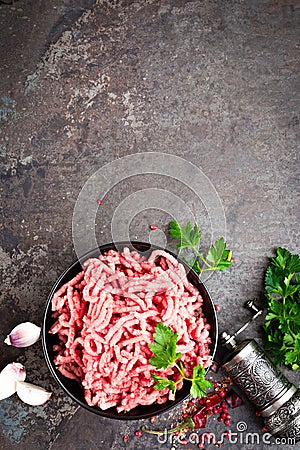 Raw ground beef meat with ingredients for cooking. Fresh minced meat Stock Photo