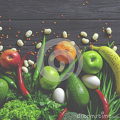 Raw healthy food, grocery set on a black wooden table Stock Photo