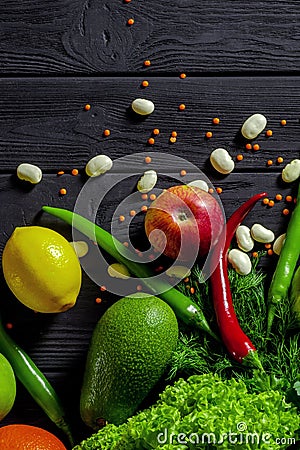 Raw healthy food, grocery set on a black wooden table Stock Photo