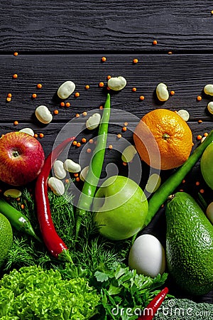 Raw healthy food, grocery set on a black wooden table Stock Photo