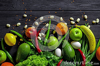 Raw healthy food, grocery set on a black wooden table Stock Photo