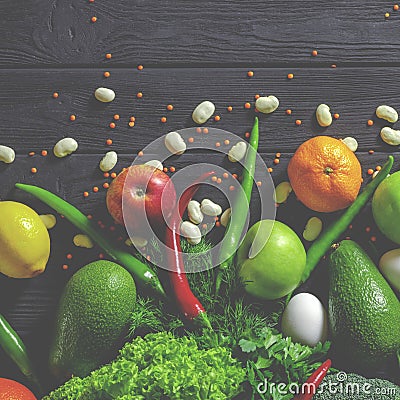 Raw healthy food, grocery set on a black wooden table Stock Photo