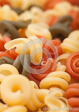 Raw homemade tricolore trottole pasta close up Stock Photo