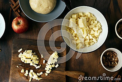Ingredients cooking apple pie strudel Apples cinnamon nuts raisins dough Stock Photo