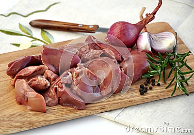 Raw liver on wooden board Stock Photo