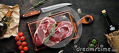 Raw marbled meat Black Angus Steak Ribeye. At the aged table. Top view. Stock Photo