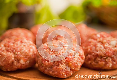Raw meat balls on the wooden cutboard Stock Photo