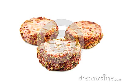 Raw meat patties with spices, three pork cutlets isolated on white Stock Photo