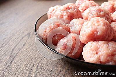 Raw meatballs cooking process wooden table Stock Photo