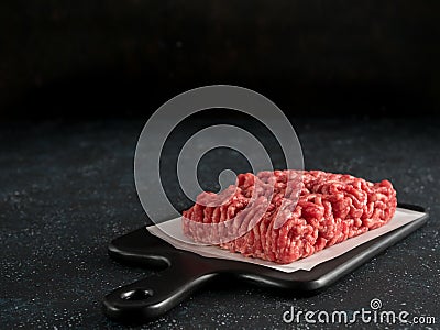 Raw minced beef on light gray cement background Stock Photo