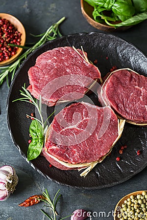 Raw organic beef steak with spices Stock Photo